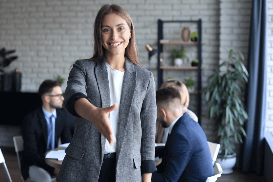 businesswoman with open hand ready handshake office 1 (1)